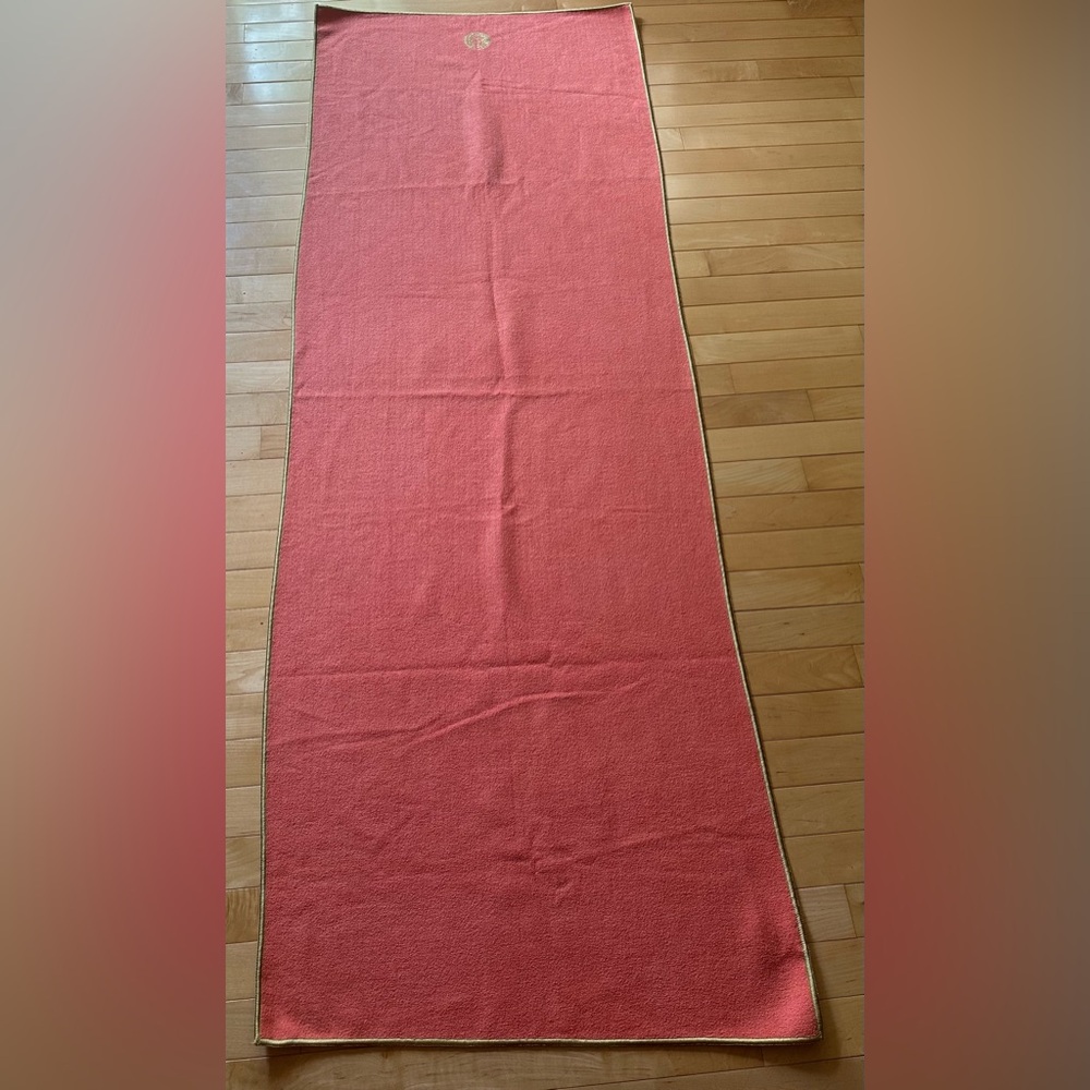 Manduka Yogitoes towel in coral with gold trim